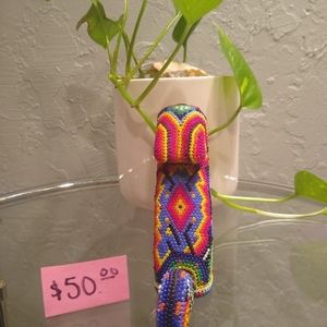 This is wooden lioness with beads